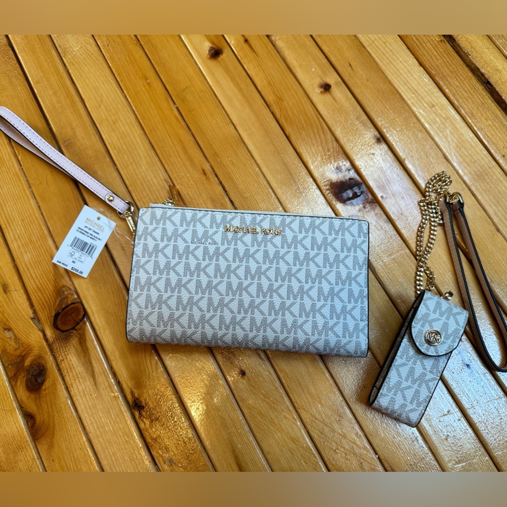 Brand new Michael Kors Wristlet and Lipstick Case
